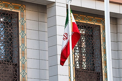 Цветы и детские игрушки несут к посольству Ирана в Минске